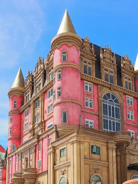Luna Castle with pink towers and golden spires in Ba Na Hills, Da Nang, Vietnam.