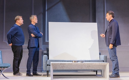 Three actors on stage during a scene from the Art Broadway show.