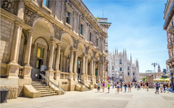 Milan's Piazza del Duomo with historic architecture and people exploring.
