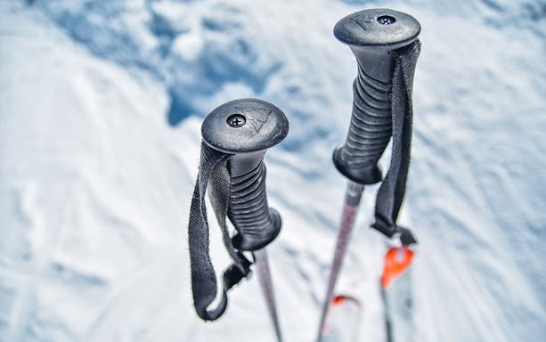 Ski poles in snow at Jisan Forest Ski Resort during day tour from Seoul.