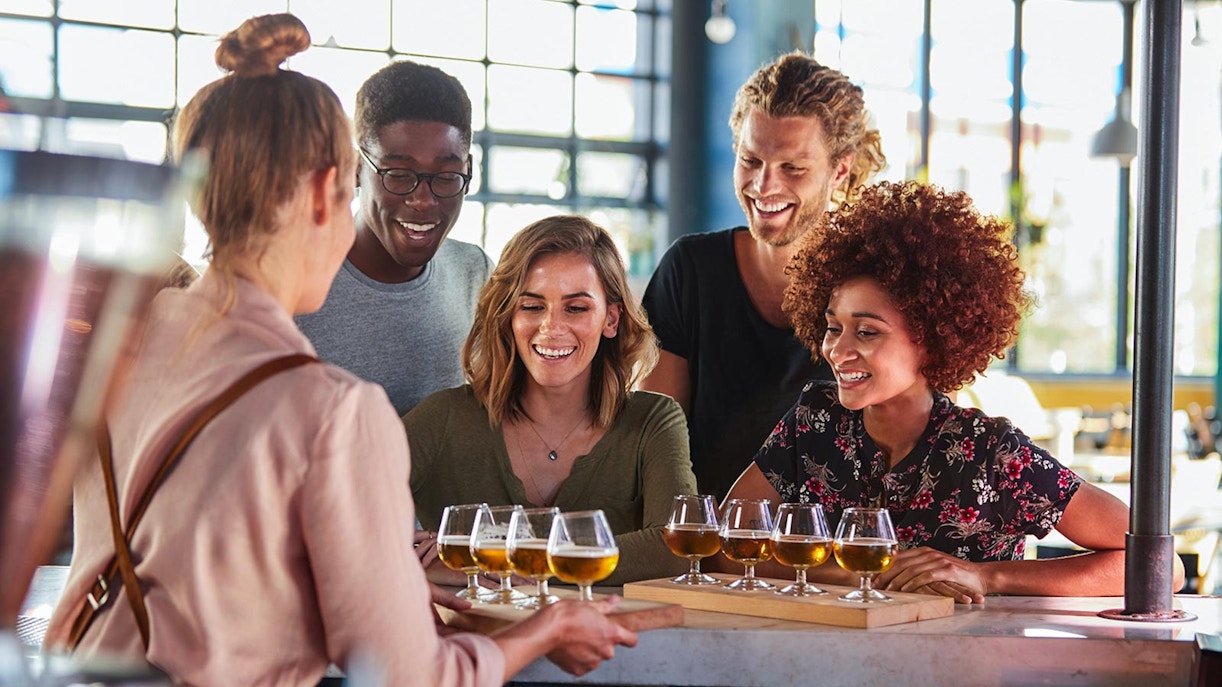 Group enjoying beer tasting at a historic Czech brewery in Prague.