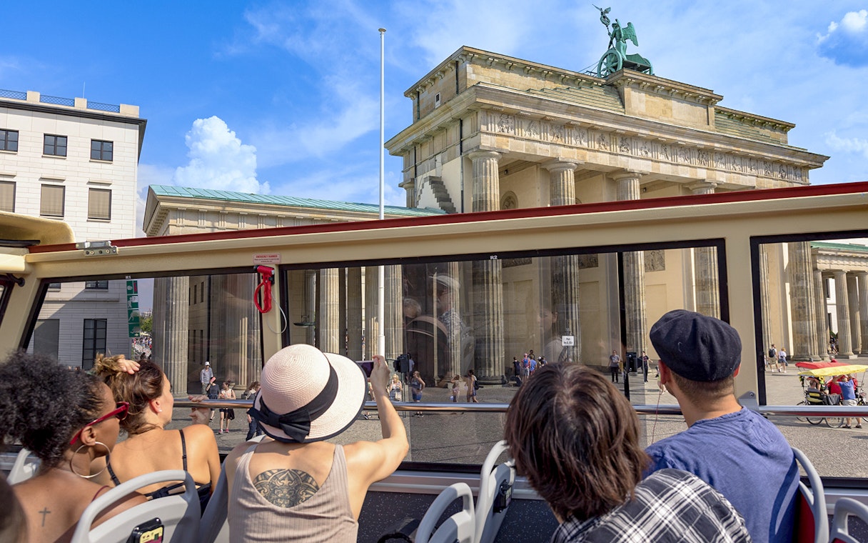 Tourists on Big Bus Berlin viewing the Brandenburg Gate.