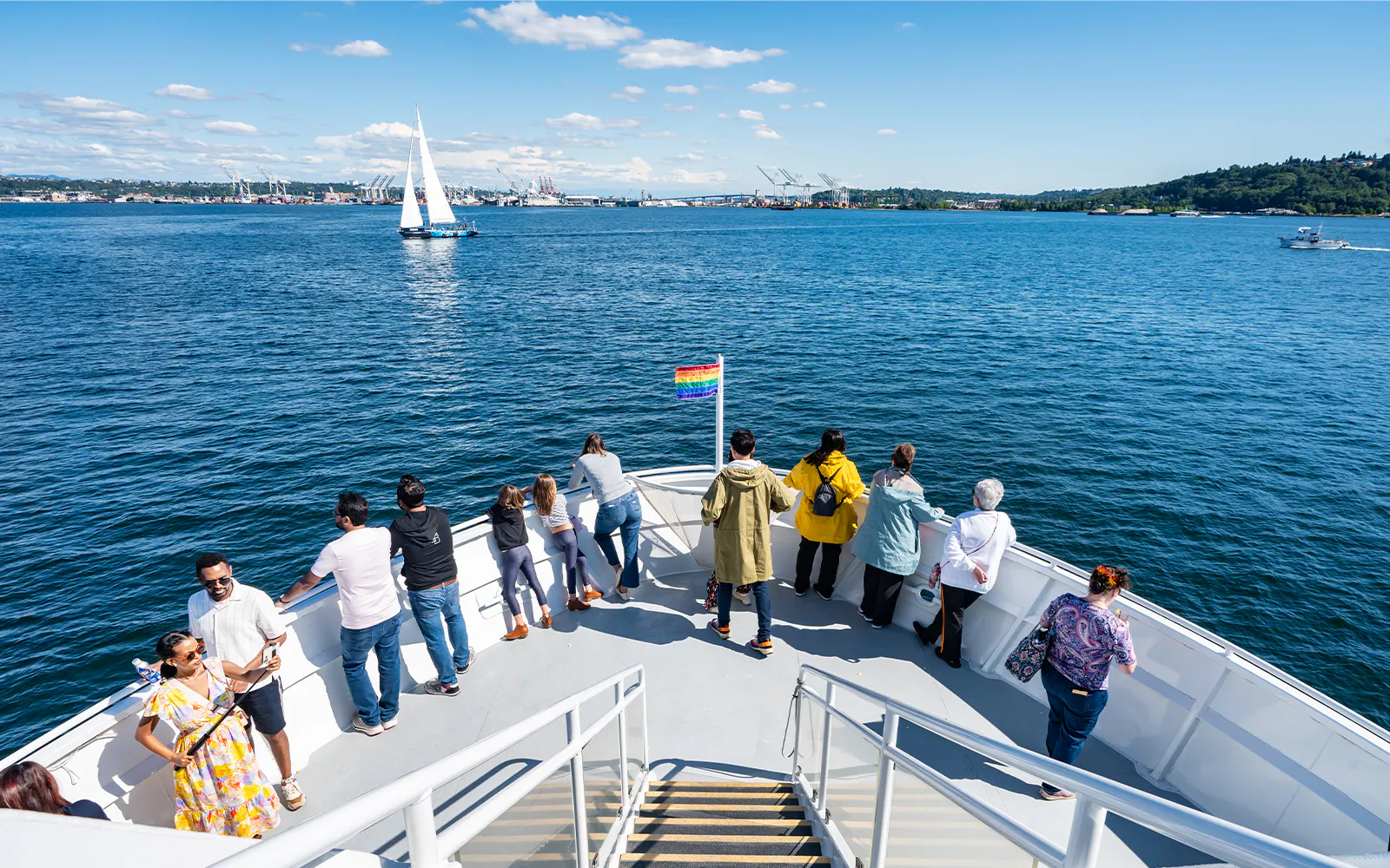 Guests on Argosy Cruise deck during Seattle Harbor Tour in summer.