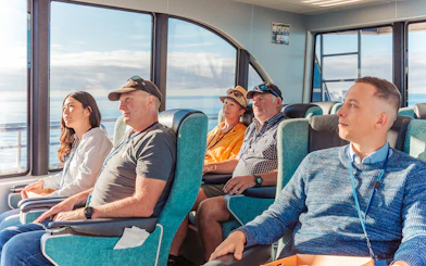 Passengers seated inside a boat during a whale watching cruise in Kaikoura.