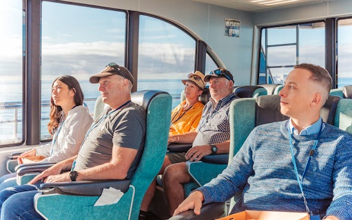 Passengers seated inside a boat during a whale watching cruise in Kaikoura.