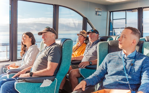 Passengers seated inside a boat during a whale watching cruise in Kaikoura.