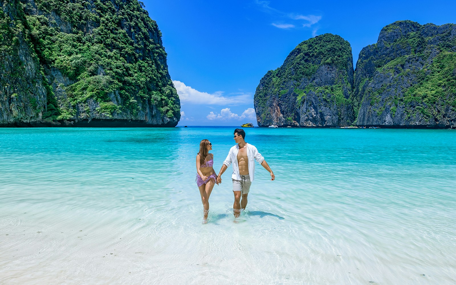 Couple enjoying themselves on a beach in Maya Bay