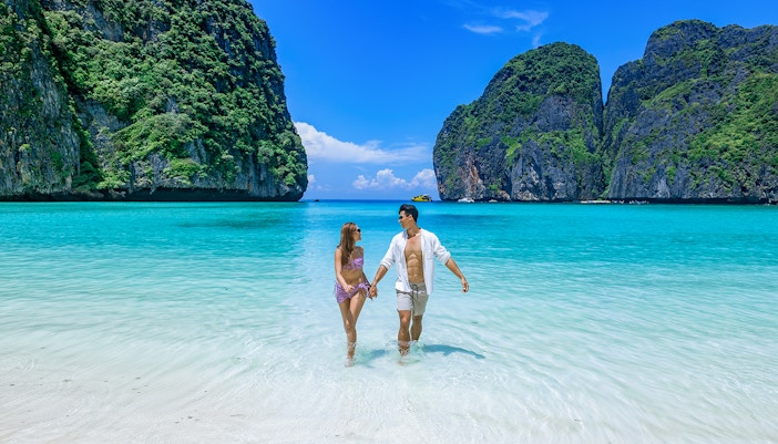 Couple enjoying themselves on a beach in Maya Bay