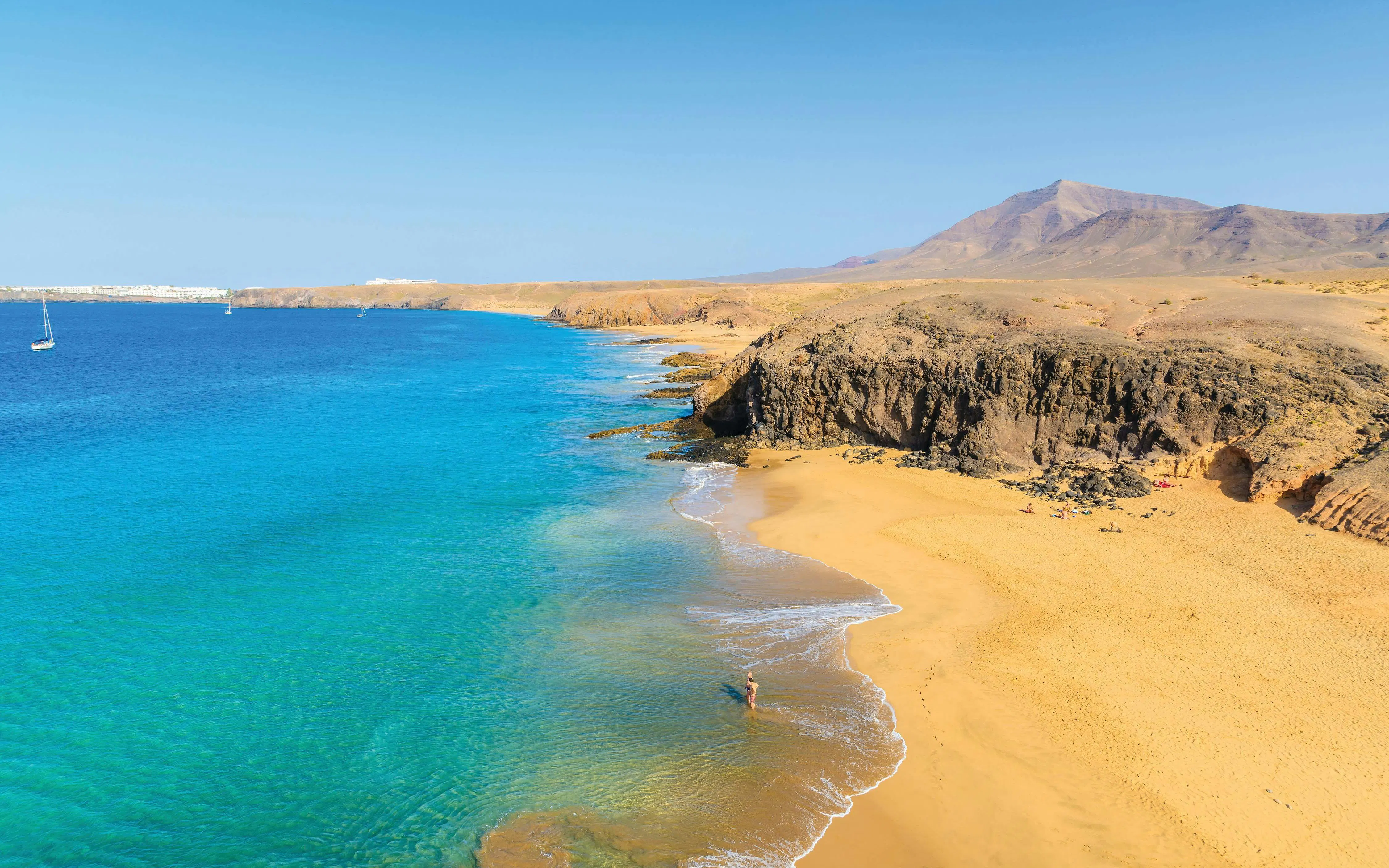 Papagayo Beaches in Lanzarote with clear blue water and sandy shores.