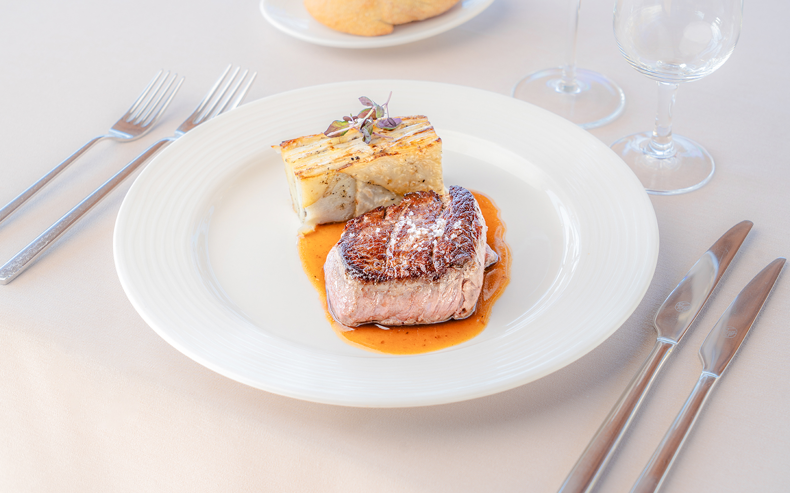 Steak and potato gratin served on Seine River sightseeing cruise.