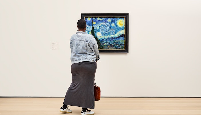 Woman viewing The Starry Night on 2nd floor of MoMa