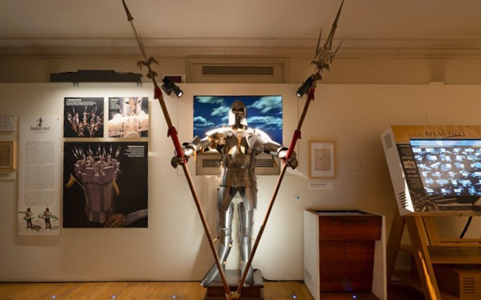 Robot soldier exhibit at Leonardo3 Museum, Milan, showcasing historical armor and design.