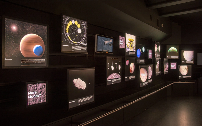 Exhibit of celestial bodies and space exploration at Royal Observatory Planetarium Gallery.