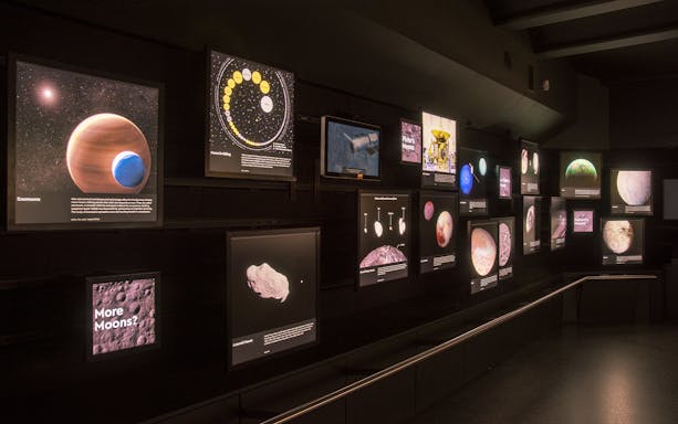 Exhibit of celestial bodies and space exploration at Royal Observatory Planetarium Gallery.