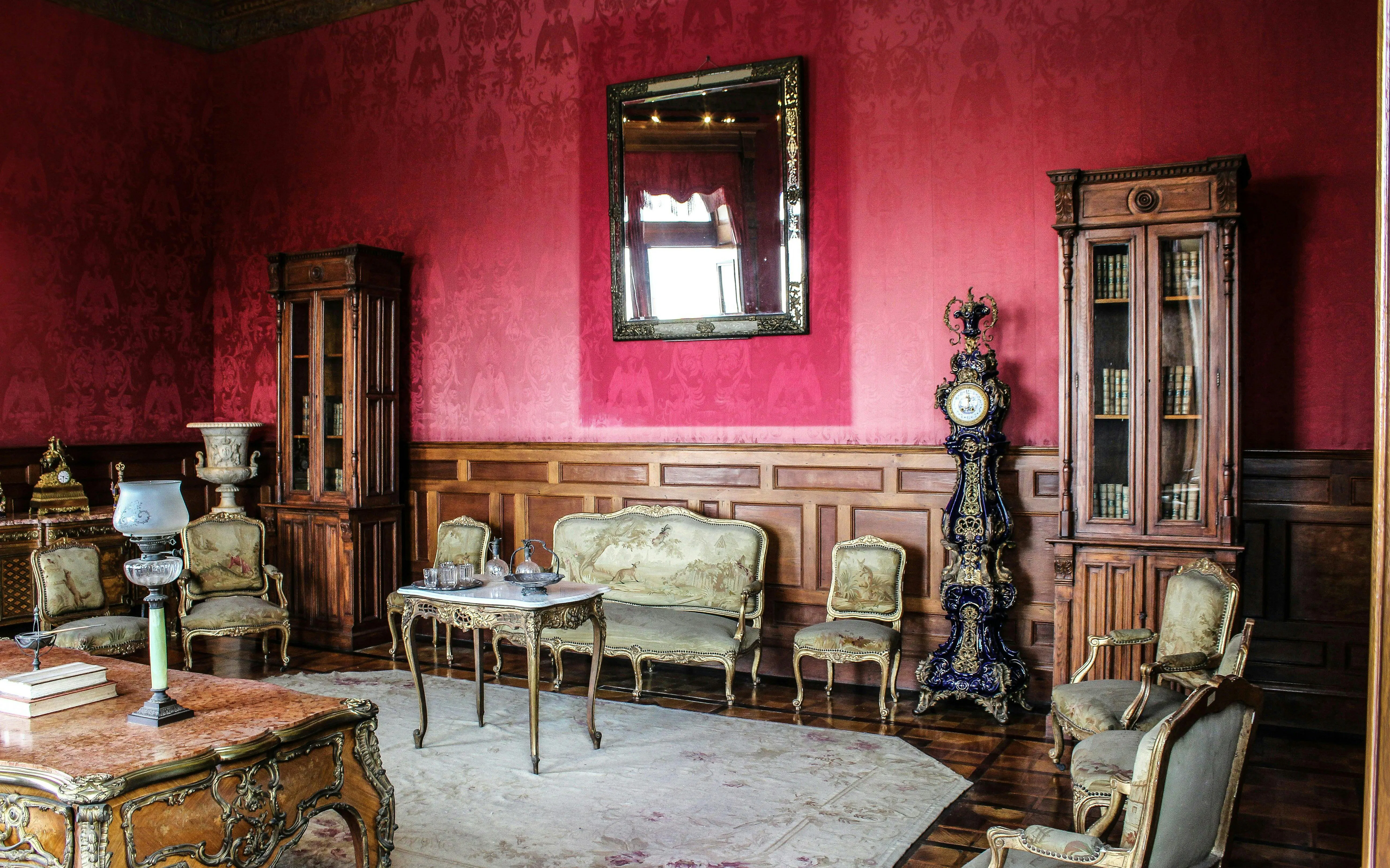 Chapultepec Castle room with antique furniture and ornate clock.
