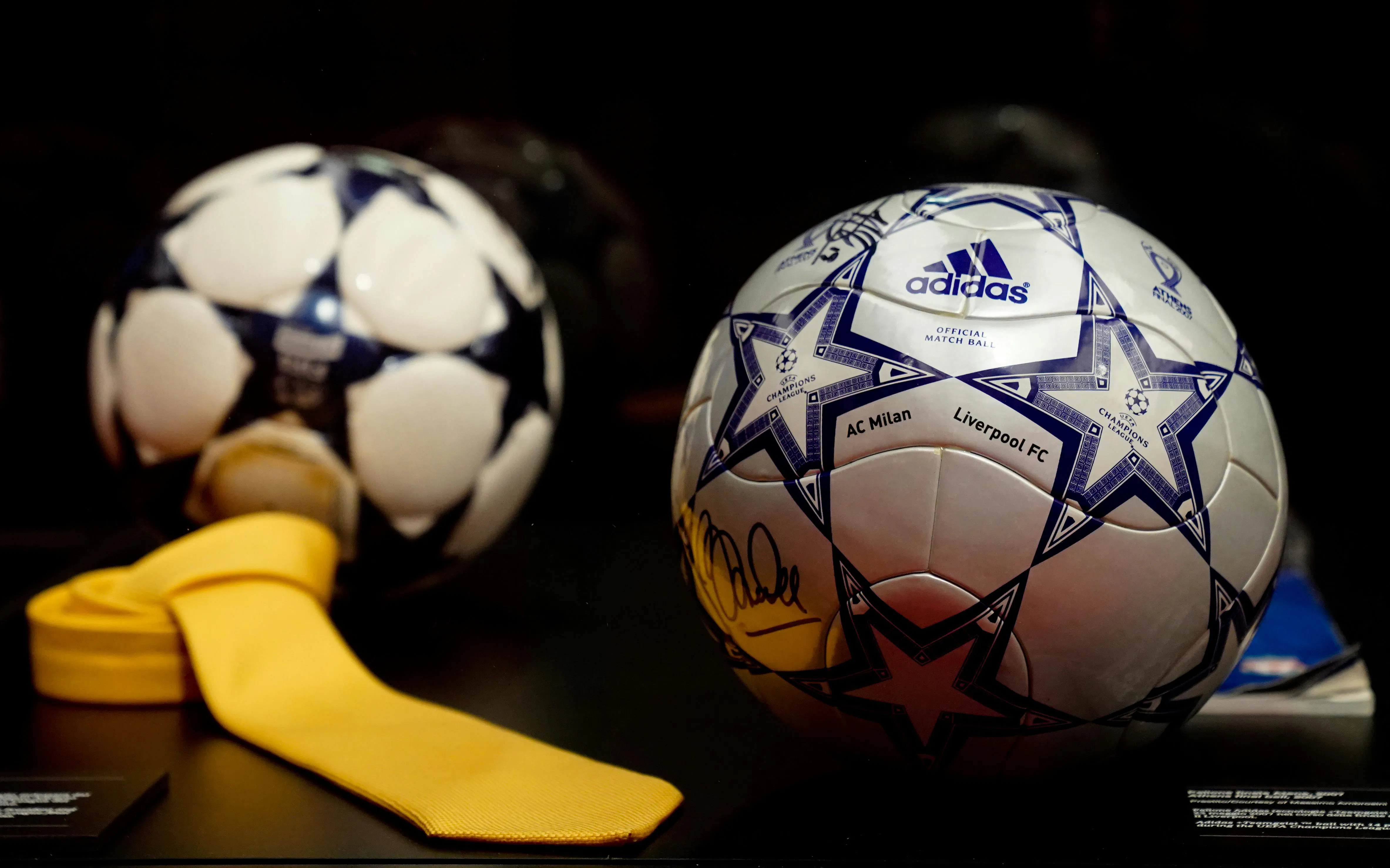 Soccer ball with AC Milan and Liverpool FC logos at Casa Milan Museum, Italy.