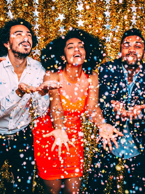 Guests celebrating with confetti on New Year’s Eve cruise in NYC.