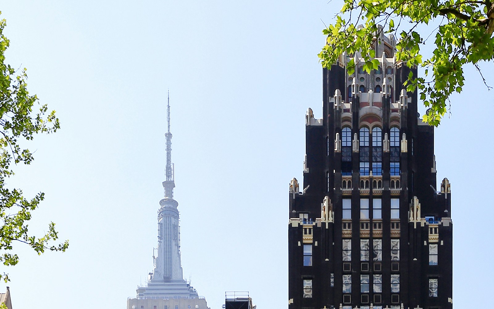 American Radiator Building with Empire State Building in background, New York City.