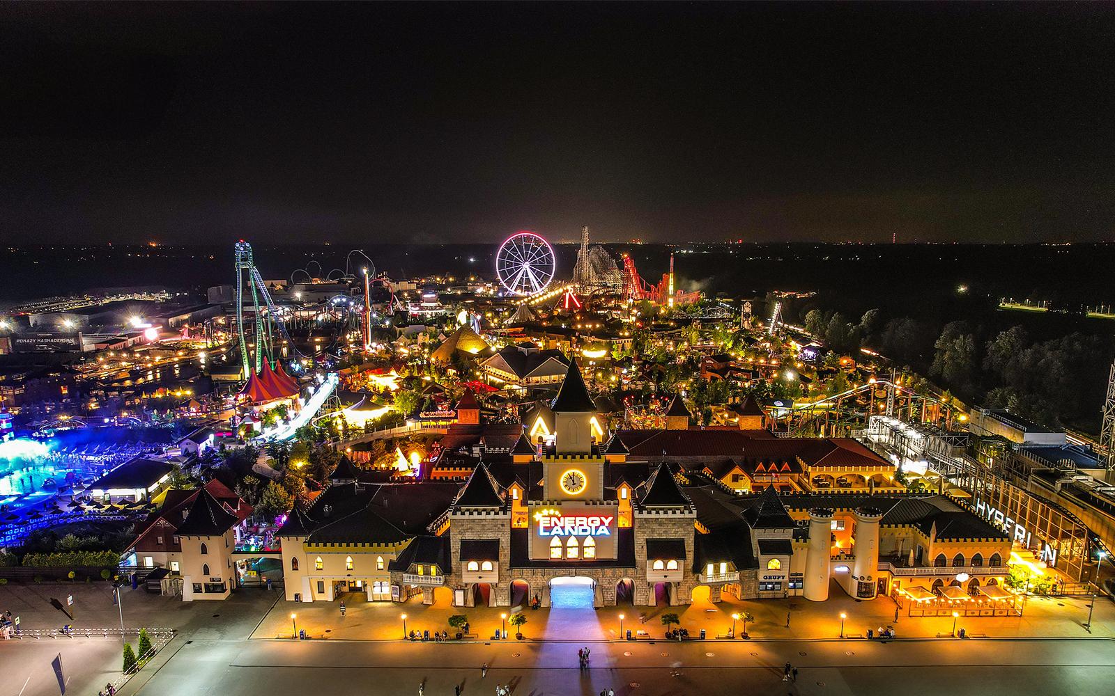 Aerial view of Energylandia Theme Park illuminated at night in Zator, near Krakow, Poland.