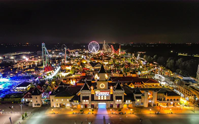 Aerial view of Energylandia Theme Park illuminated at night in Zator, near Krakow, Poland.
