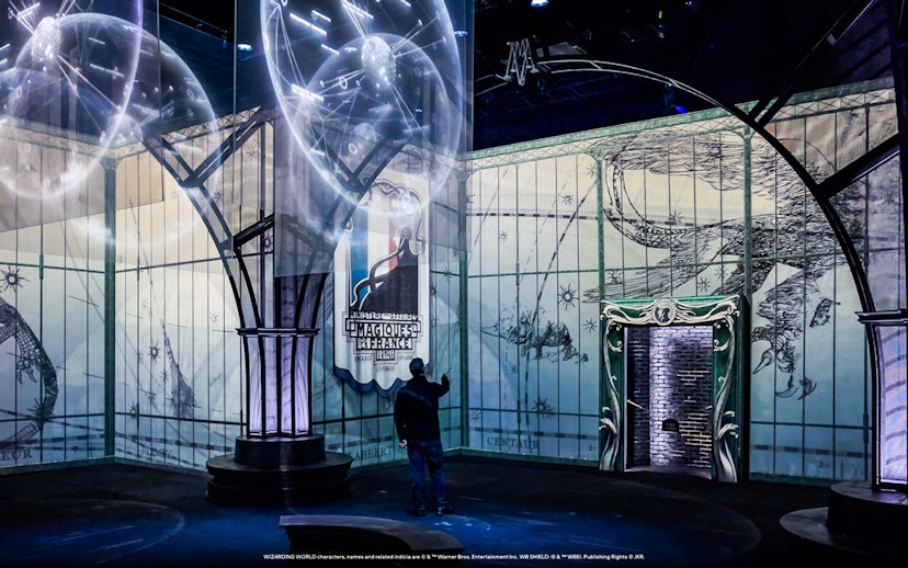 Interactive Harry Potter exhibit with magical projections and themed decor.