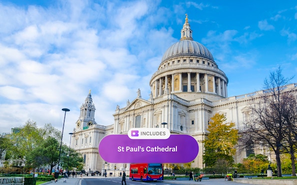St. Paul's Cathedral in London with a red double-decker bus in front.