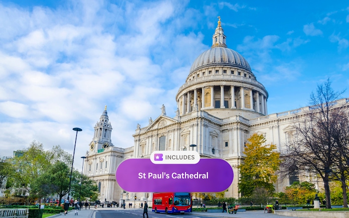 St. Paul's Cathedral in London with a red double-decker bus in front.