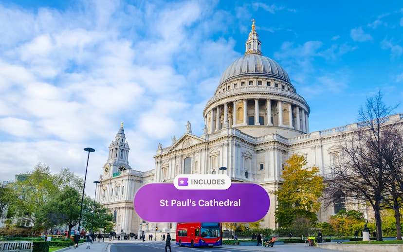 St. Paul's Cathedral in London with a red double-decker bus in front.