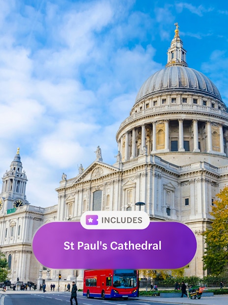 St. Paul's Cathedral in London with a red double-decker bus in front.