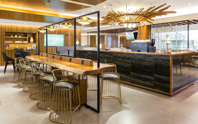 Plaza Premium Lounge seating and bar area at Rio de Janeiro Airport, T2 International Departures.