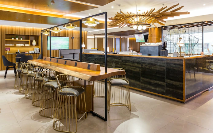 Plaza Premium Lounge seating and bar area at Rio de Janeiro Airport, T2 International Departures.