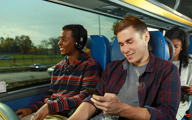 Passengers enjoying a Megabus ride to Niagara Falls.