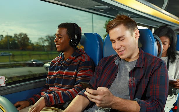 Passengers enjoying a Megabus ride to Niagara Falls.