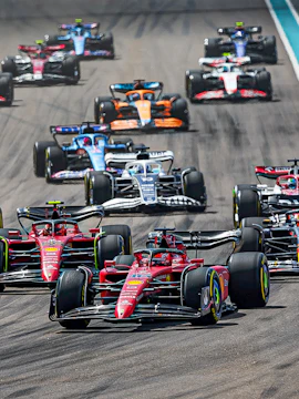 Race cars competing at the F1 Miami Grand Prix.
