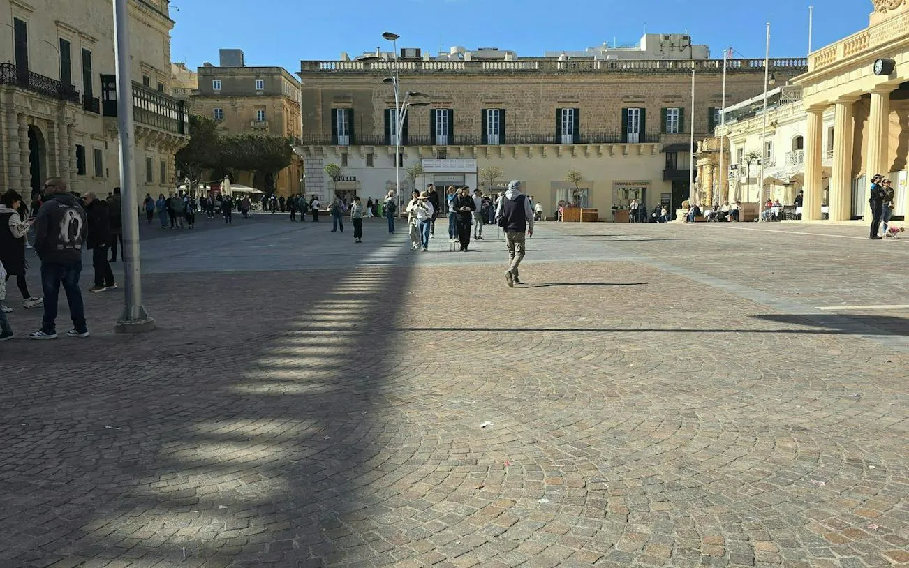 Valletta city square with people exploring during the Knights Treasure Hunt game.