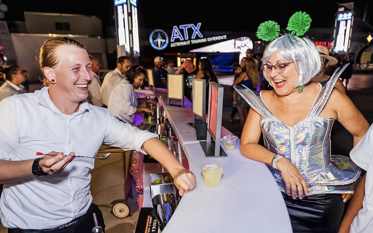 Guests enjoying drinks at Kennedy Space Center's exclusive after-hours event.