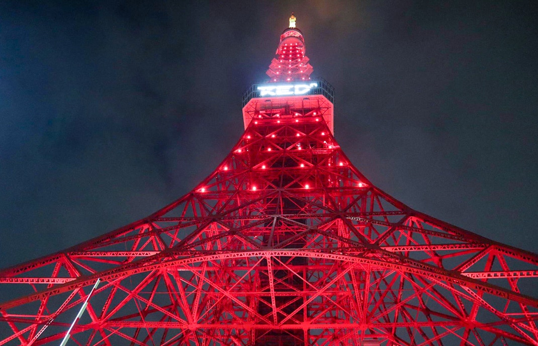 RED° TOKYO TOWER interior with interactive digital art displays and visitors exploring exhibits.
