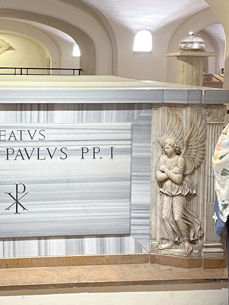 Tomb of Pope John Paul I in Vatican Grottoes, Vatican City, with a guide explaining.