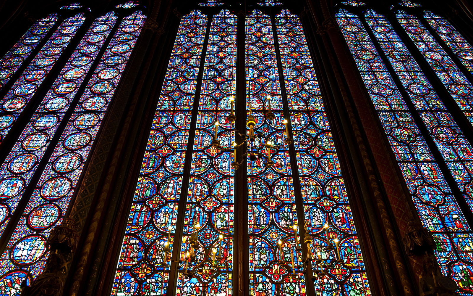 Stained glass windows depicting biblical scenes in Sainte-Chapelle, Paris.