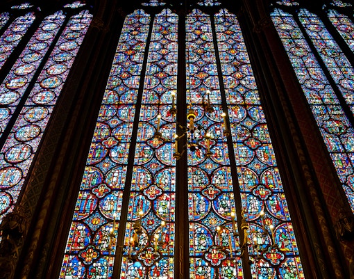 Stained glass windows depicting biblical scenes in Sainte-Chapelle, Paris.