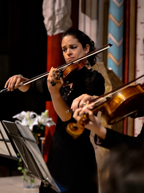 Musicians playing violins at St Germain des Prés Church, Paris, France.