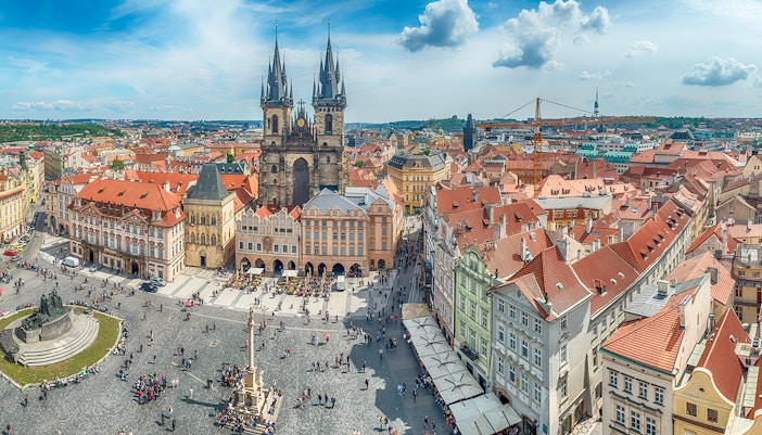 Aerial view of Tyn Church and Old Town Square crowded with people, Prague