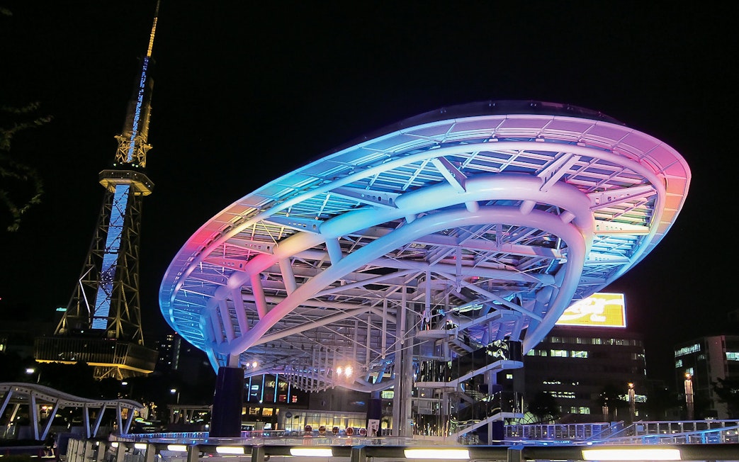 Nagoya TV Tower and Oasis 21 illuminated at night, Japan, accessible with Kintetsu Rail Pass.