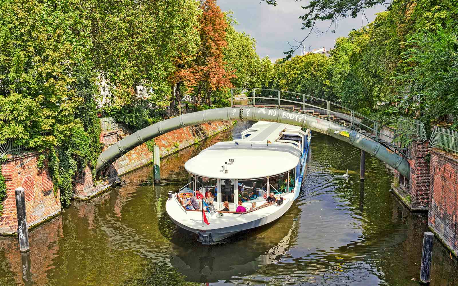 Landwehrkanal Berlin boat tour with scenic city views and historic bridges.