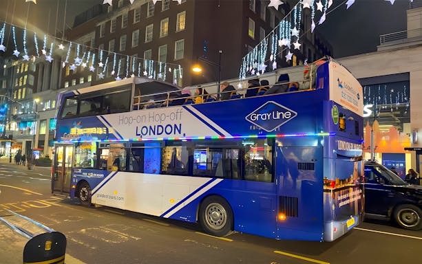 Open-top bus on London Christmas Lights Night Tour by Golden Tours.