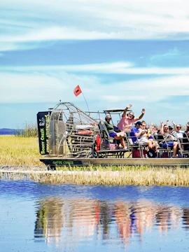 Airboat with tourists on Boggy Creek in Orlando.