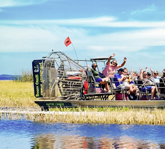 Airboat with tourists on Boggy Creek in Orlando.