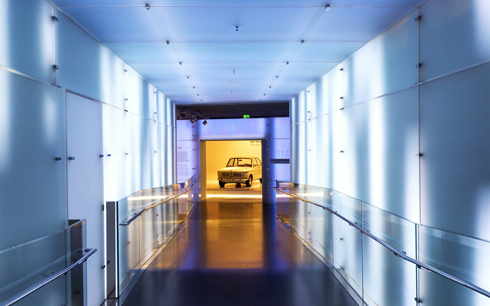 BMW Museum hallway leading to vintage car display, Munich.