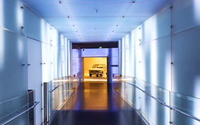 BMW Museum hallway leading to vintage car display, Munich.