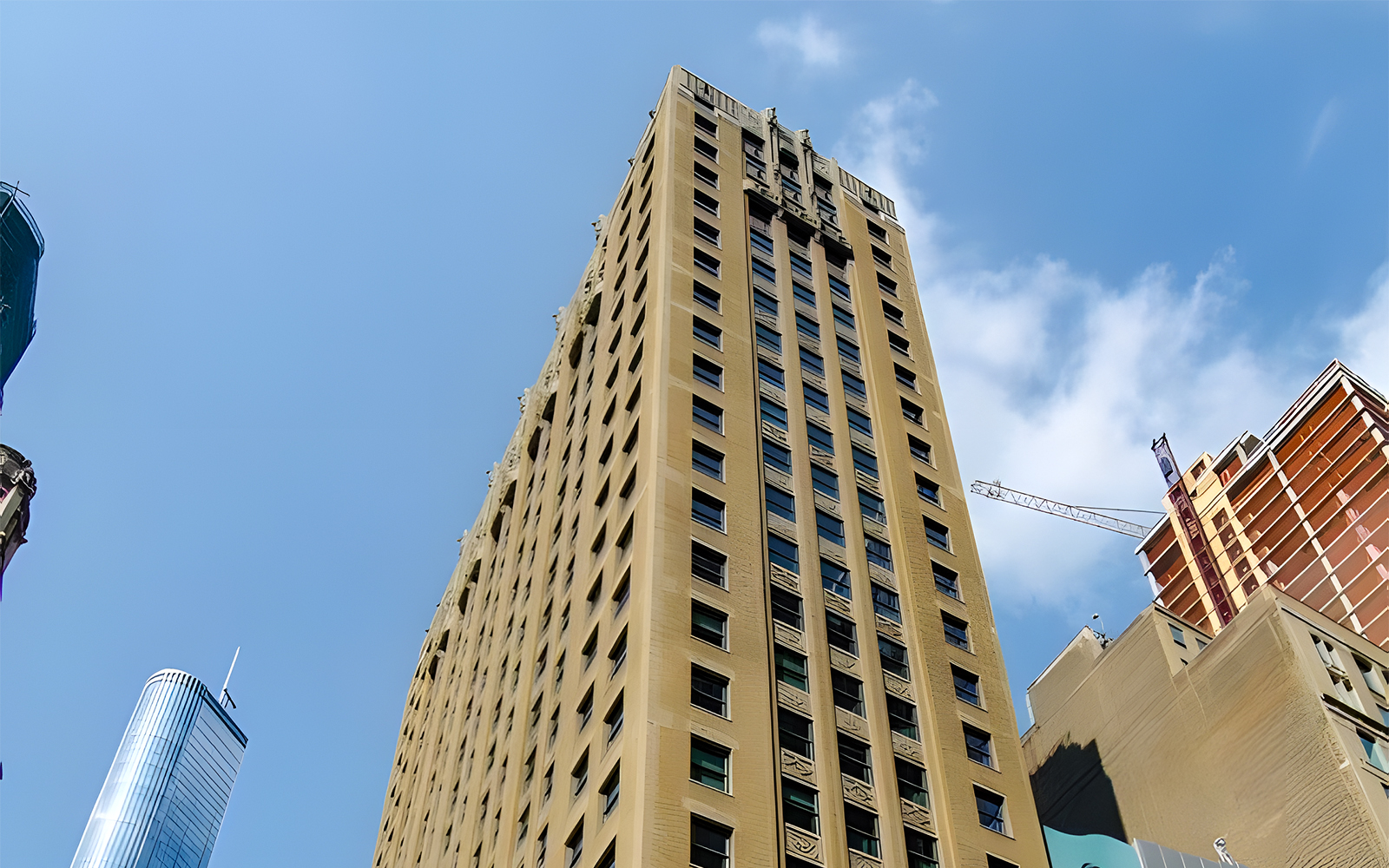 Virgin Hotel building exterior in downtown Chicago against a clear sky.